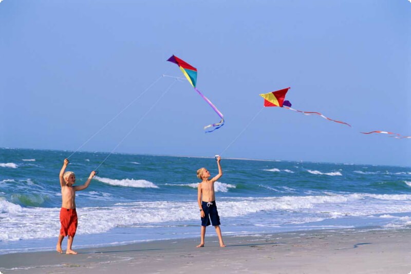 flying kite on the beach with kids