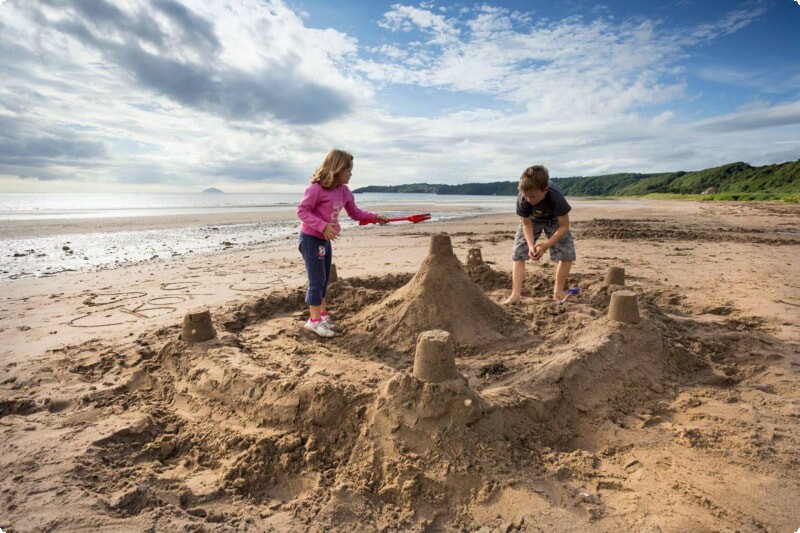 sandcastle building with kids on the beach